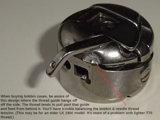 Avoid this bobbin case design (with one guide hanging off the side)